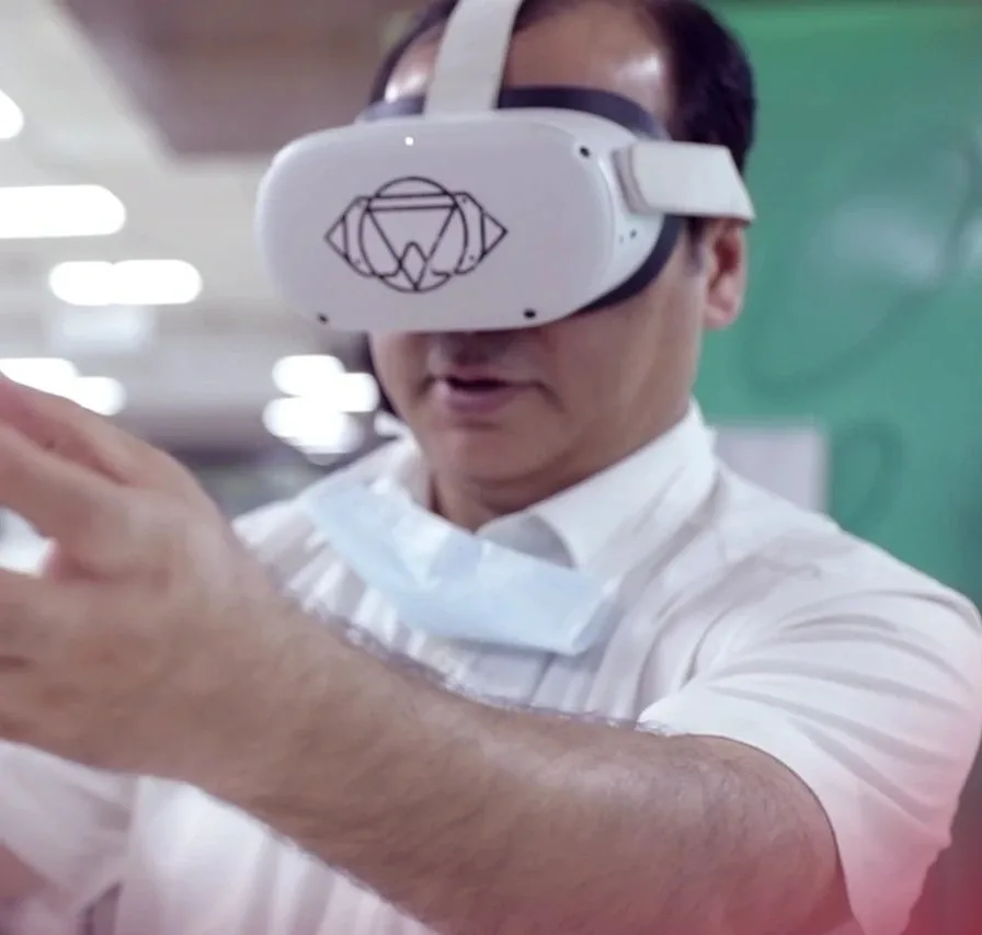 A surgeon using the SSi Maya headset